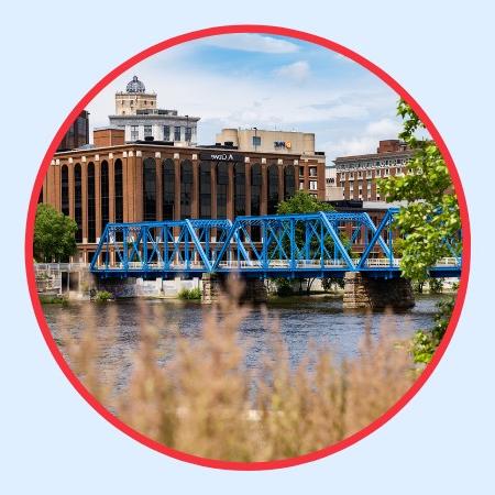 Grand Rapids' Blue Bridge in the background with grass in the foreground